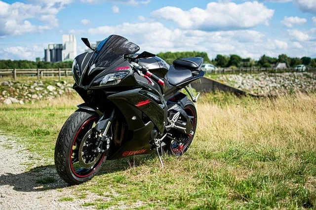 Motorcycle brakes being inspected for wear and fluid levels