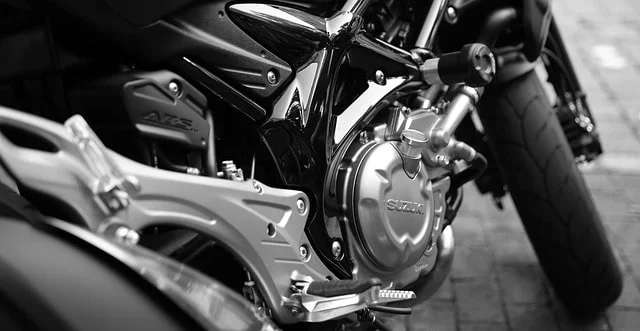 Motorcyclist wearing ventilated gear riding under a bright sunny sky
