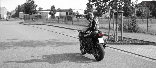 Motorcycle rider complying with legal protective gear requirements